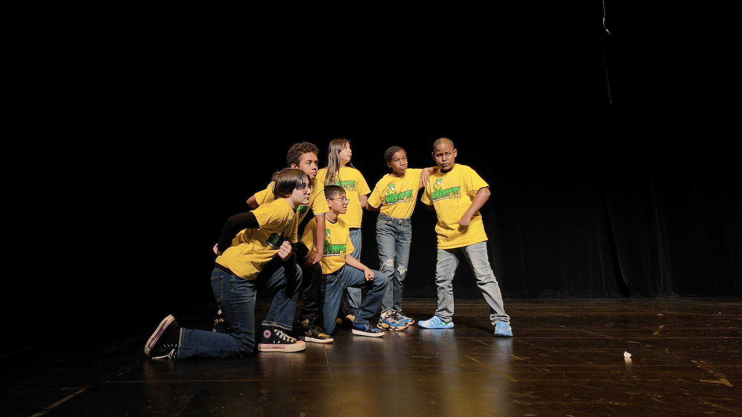 Elementary students perform on stage at the Knight Theater 